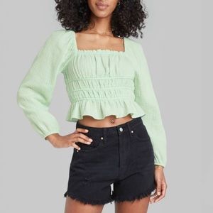 Long, puffed sleeve green blouse